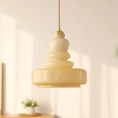Warm Glass Pumpkin Pendant Lighting with Metal Accents