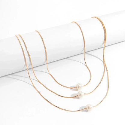 Elegant Triple Strand Pearl Necklace