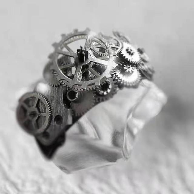 Unique Gold Tone Mechanical Uni Ring